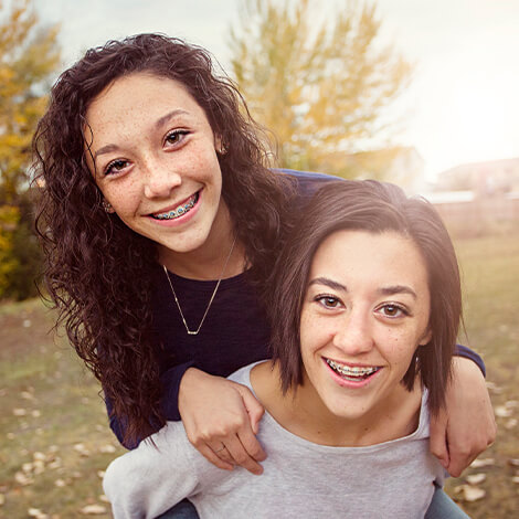 two sisters with braces